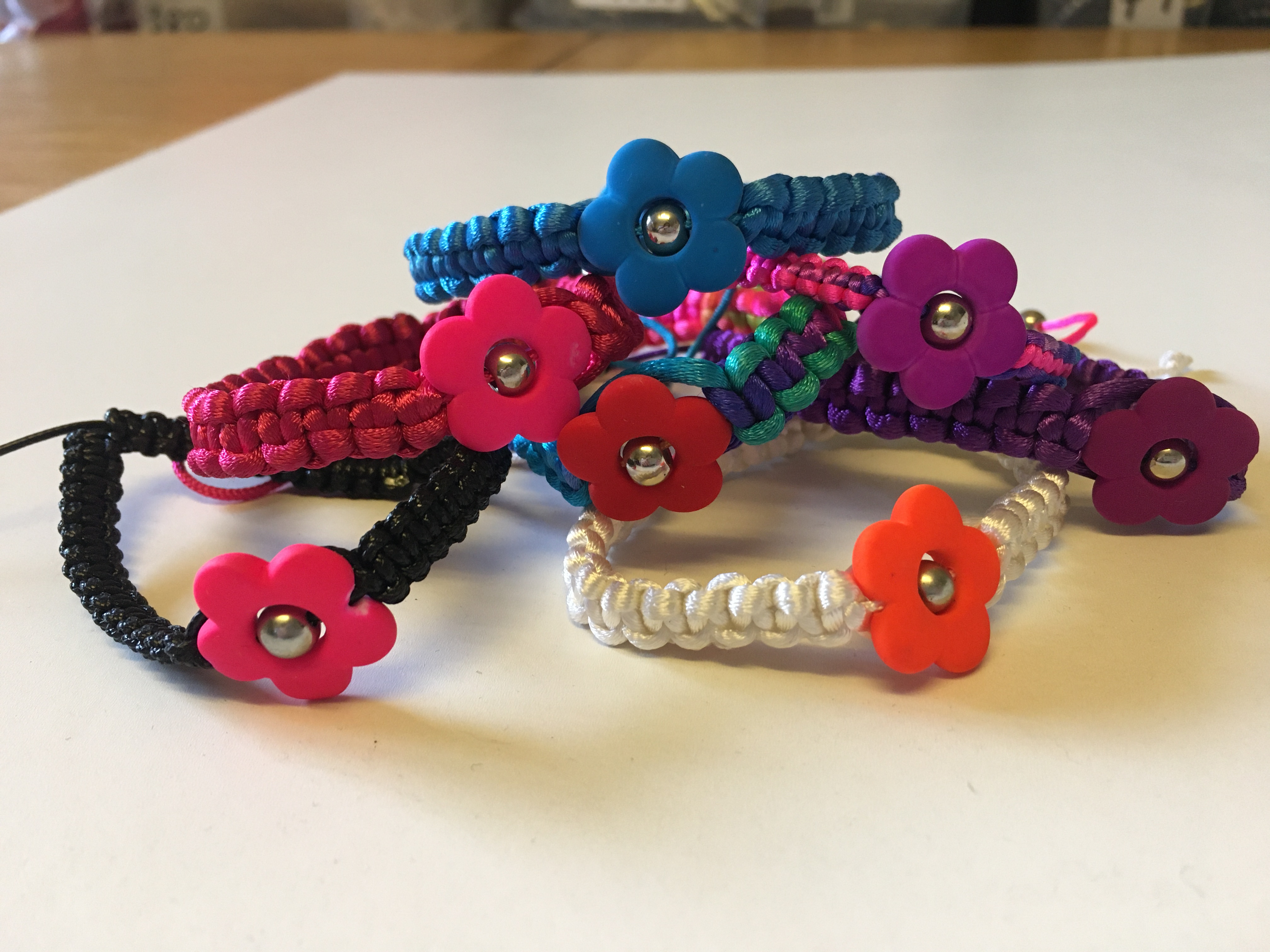 Wholesale Joblot Of 50 Flower Braided Bracelets In multiple Colour Variations