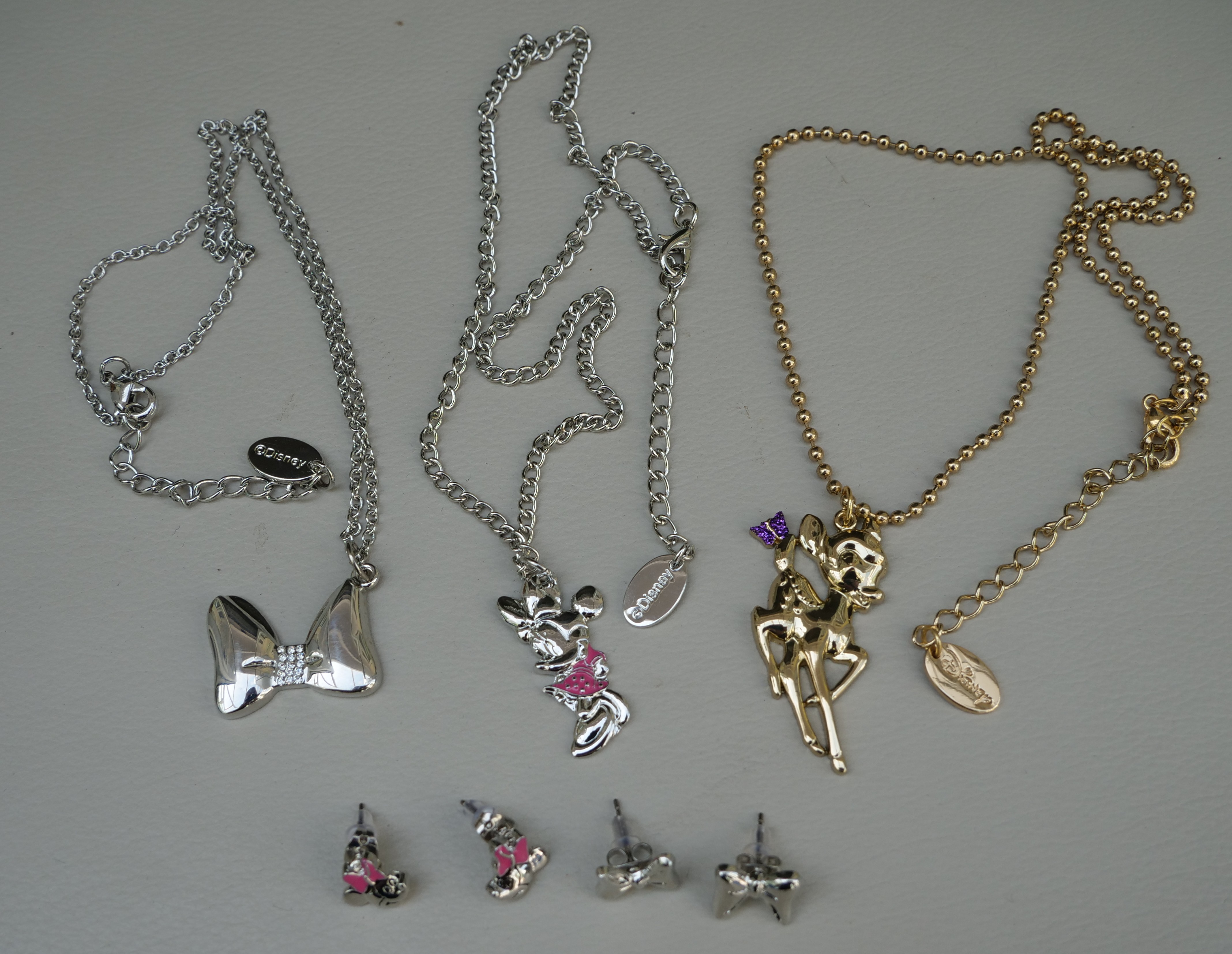60 items of Genuine Disney jewellery. Pendants & earrings. Minnie Mickey Mouse Bambi.  