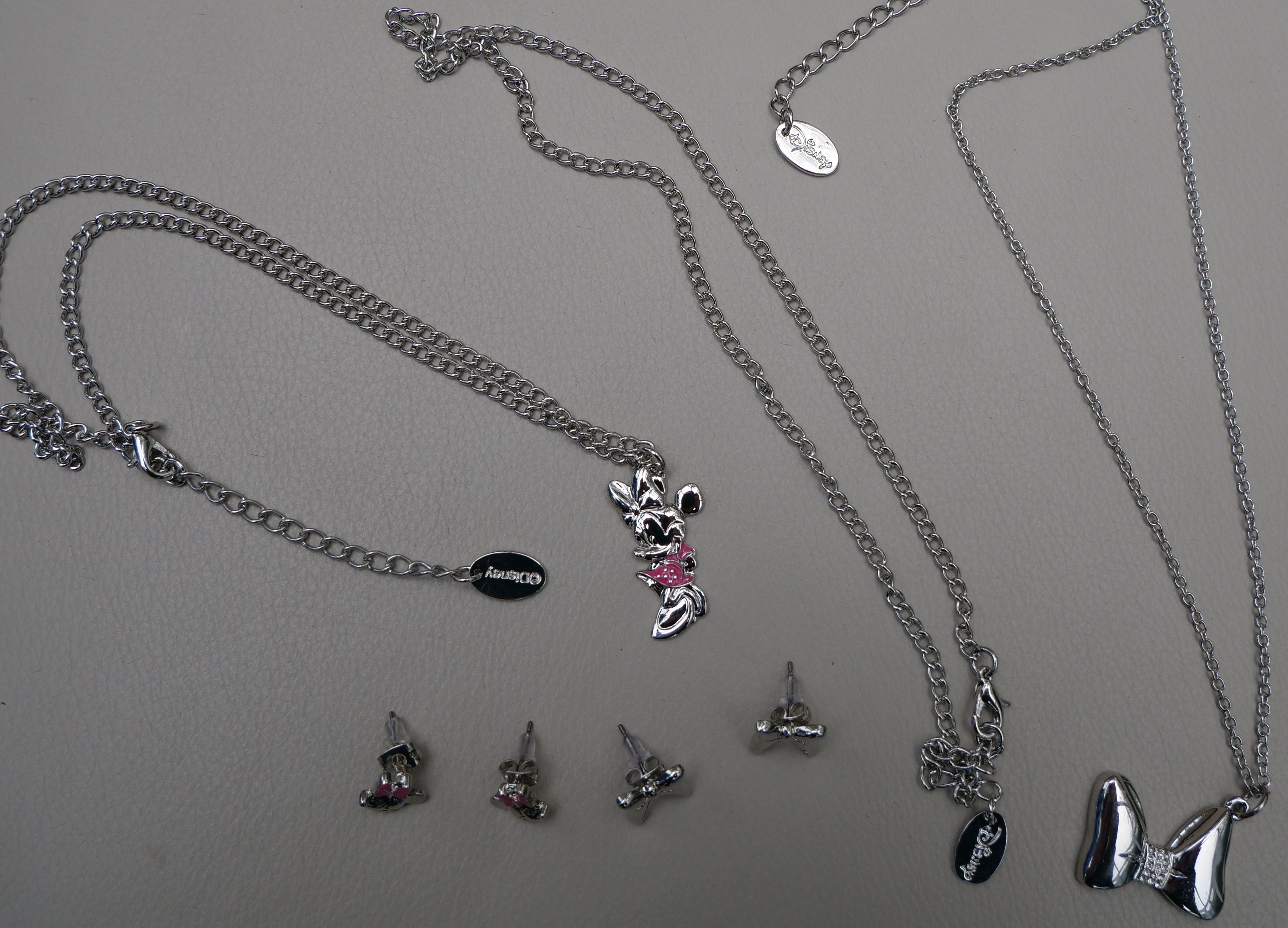 100 Items of genuine Disney Jewellery Pendants and earrings RRP £1716