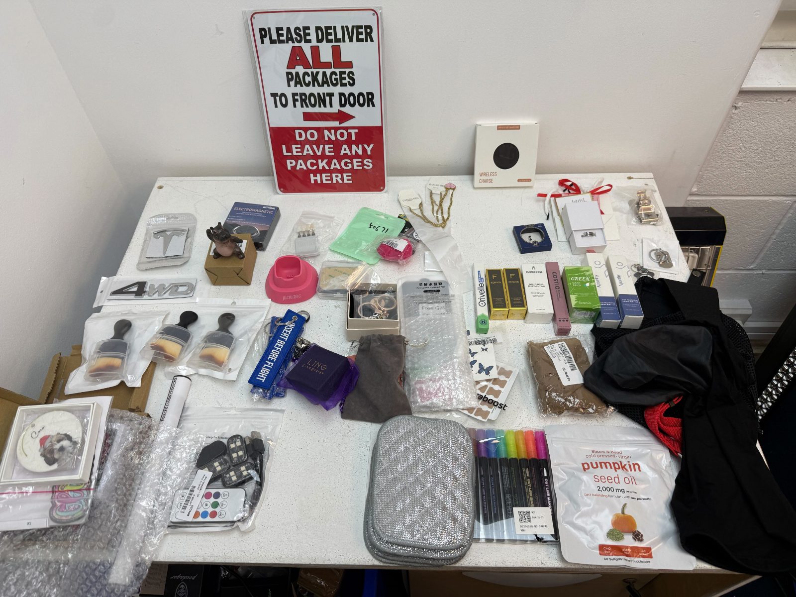All 50 abandoned parcels from the returned lot opened and laid out on our warehouse table